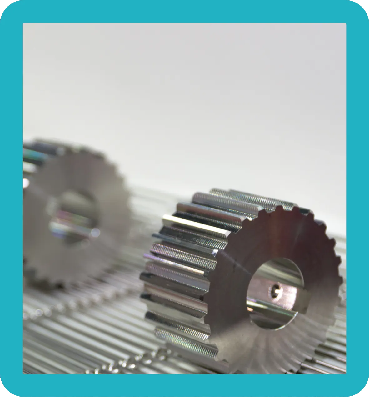 Titanium cogs sitting on metal.