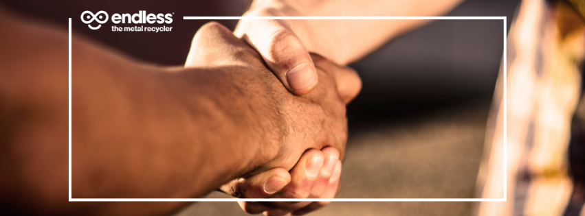 Handshake from agreement on scrap metal price match.