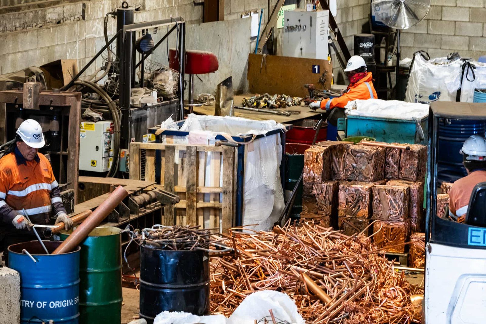 Endless the metal recycler team members grading recycled copper scrap metal